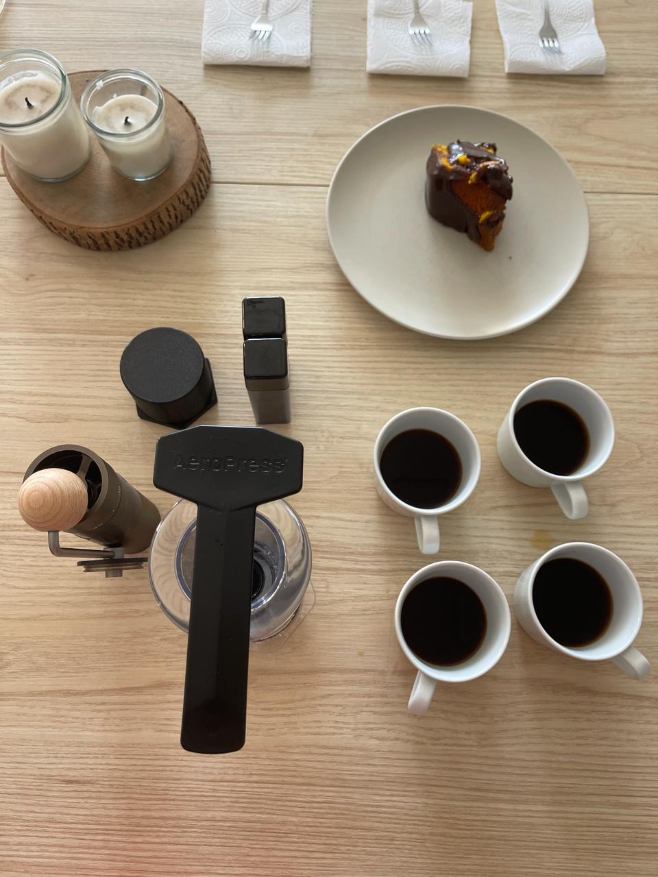 Four cups of black coffee with the Aeropress and hand grinder